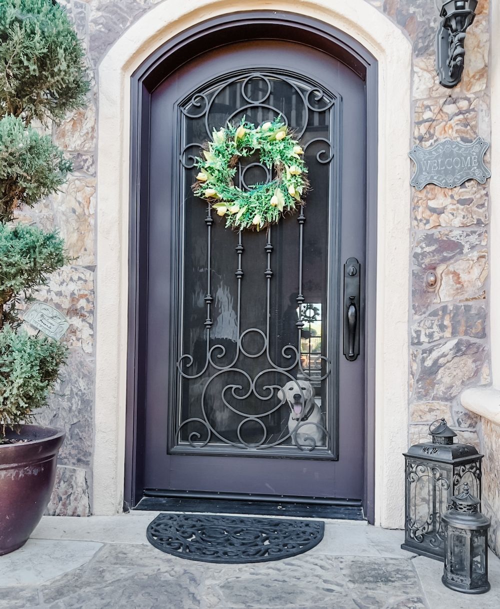 A door with a wreath on top of it