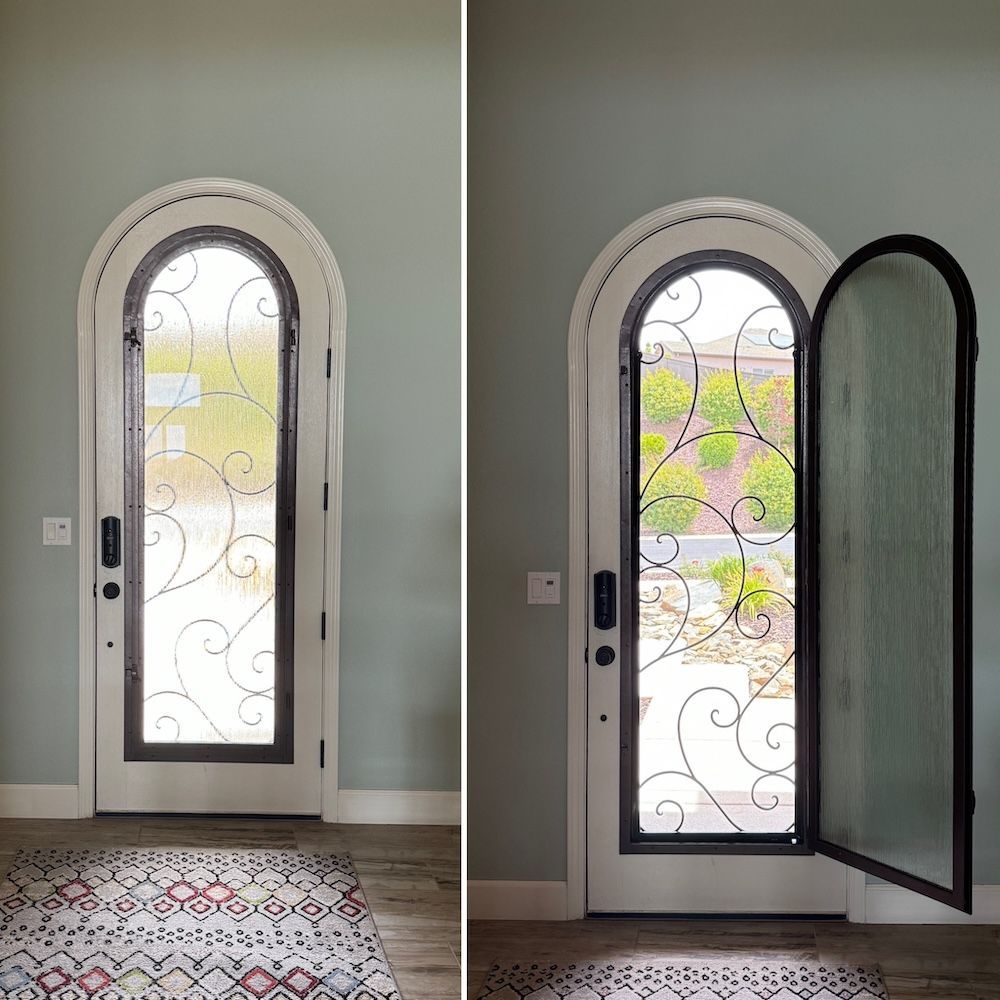 A door with a wrought iron design on it is open and closed
