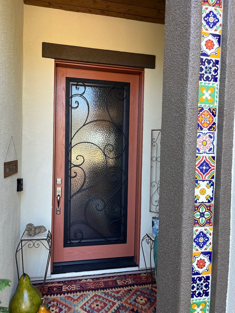 A door with a wrought iron design on it