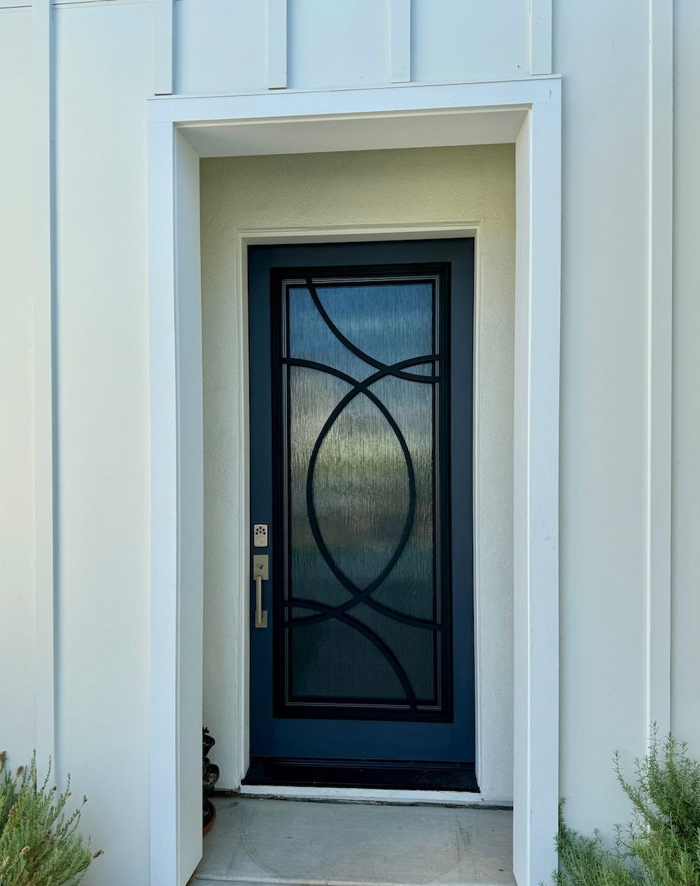 A blue door with a circular design on it