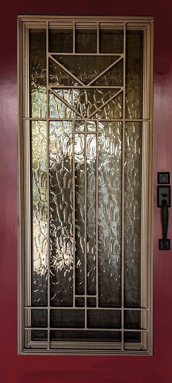 A door with a stained glass window and a metal frame.