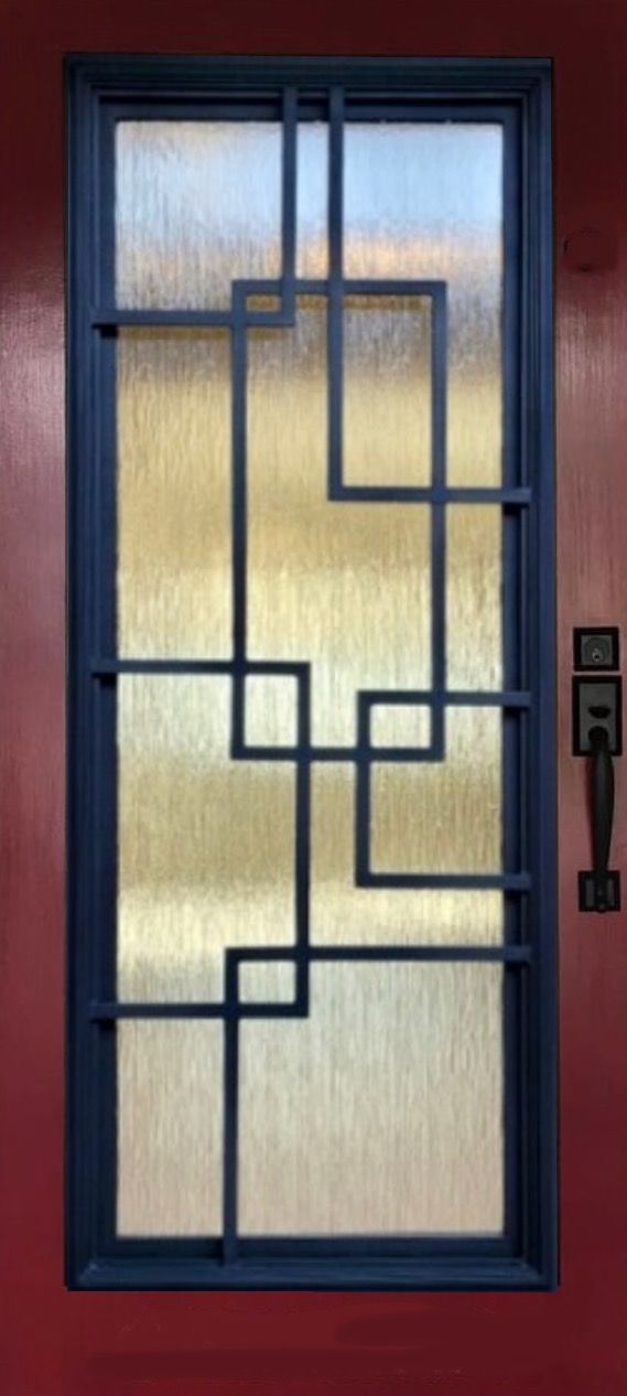 A door with a wrought iron design on it