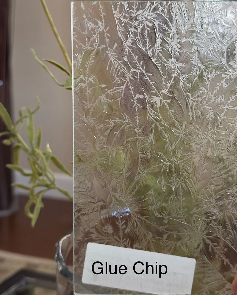 A piece of glass with a label that says glue chip on it.