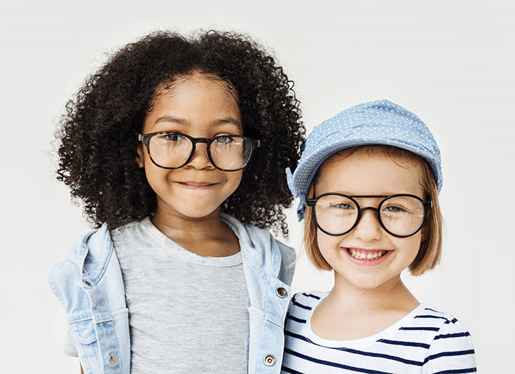 two young girls wearing glasses
