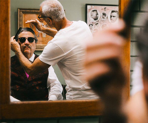 A Man With A Sunglasses Having A Haircut — Bangalow Barber Shop in Bangalow NSW