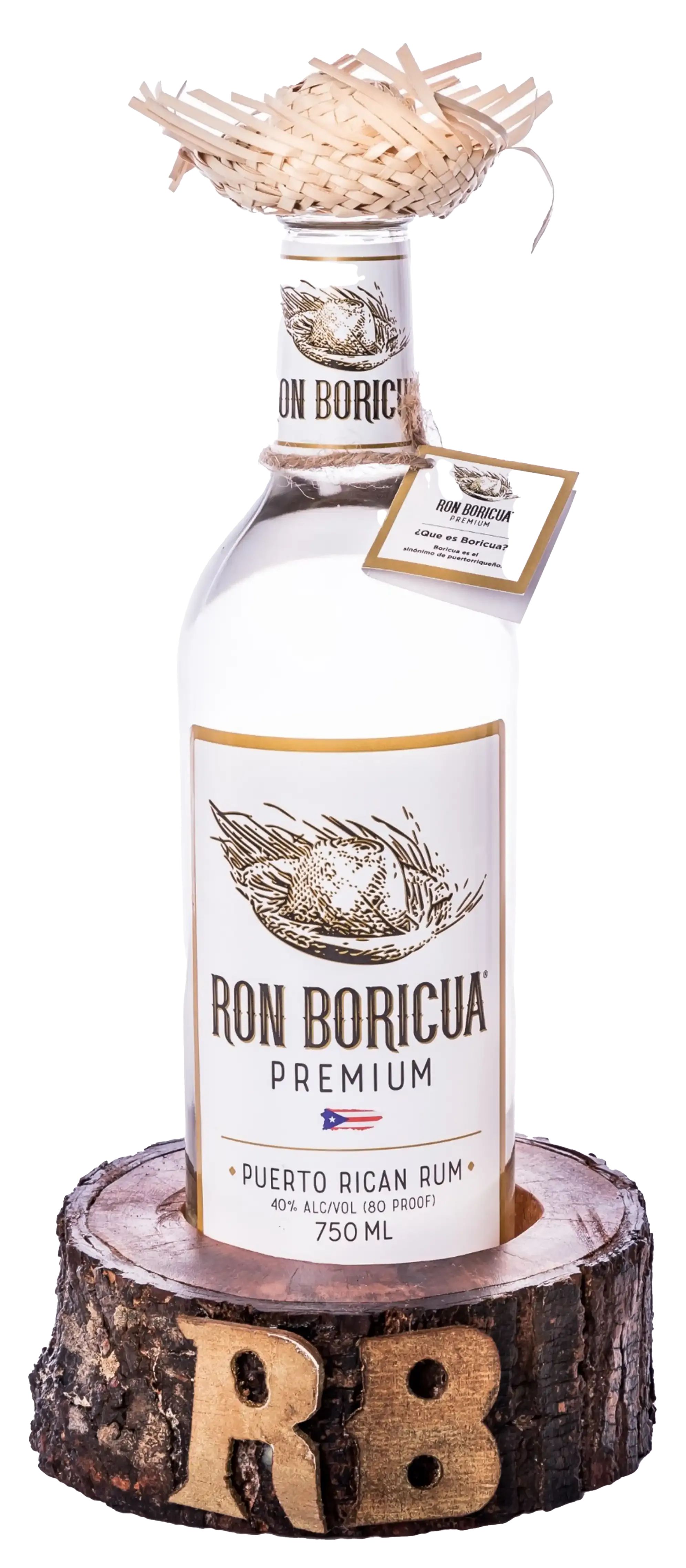 A bottle of Ron Boricua is sitting on top of a wooden stump.