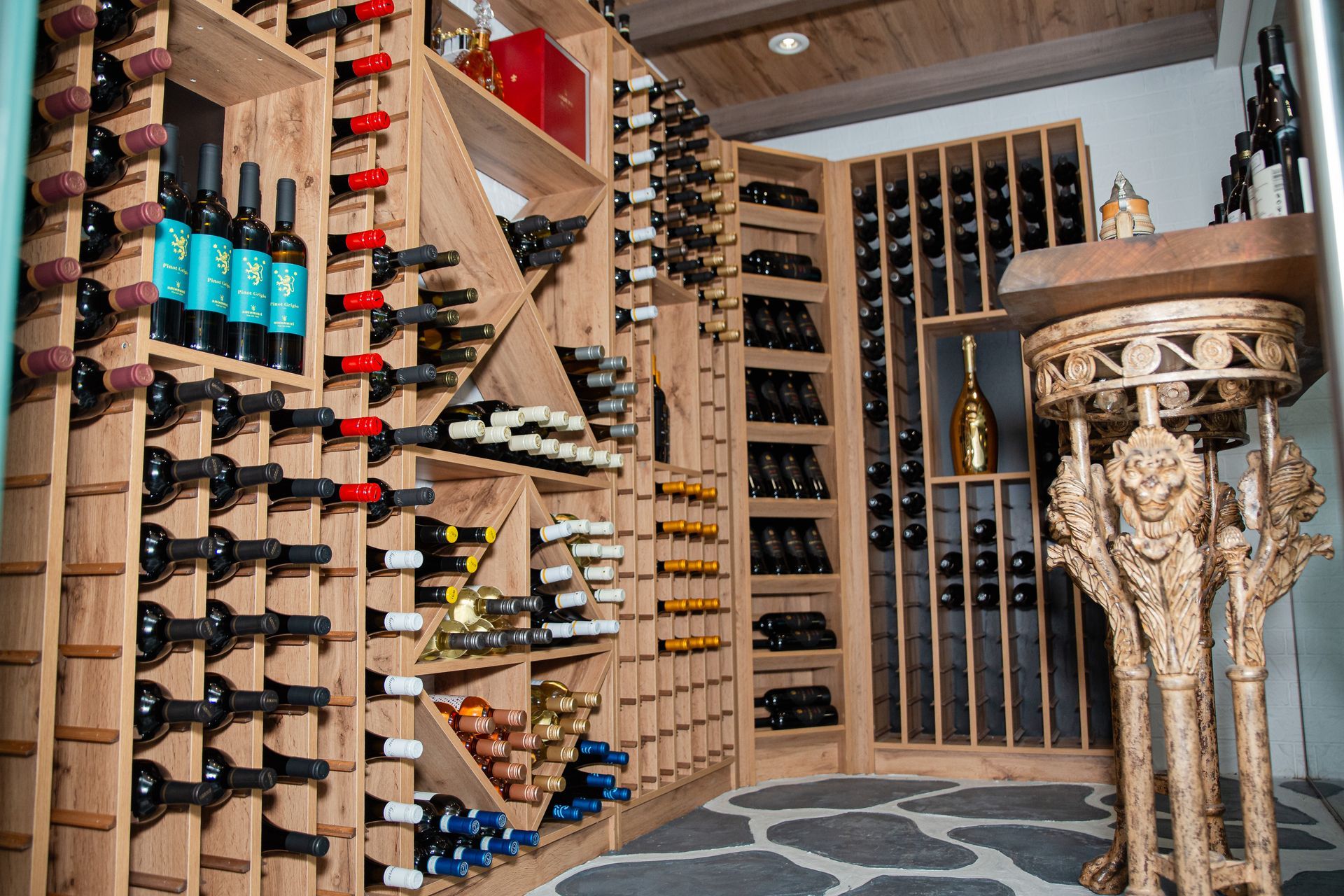 A wine cellar filled with lots of bottles of wine