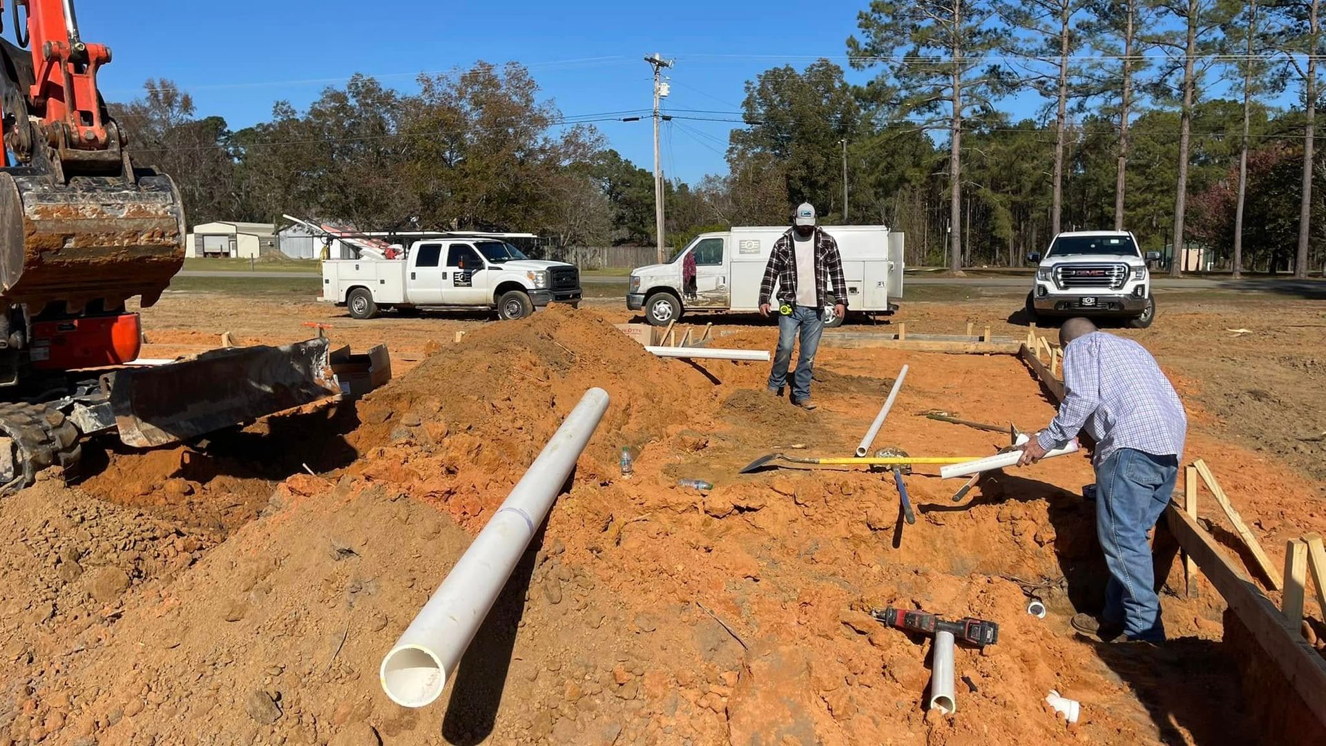 A group of construction workers are working on a construction site.