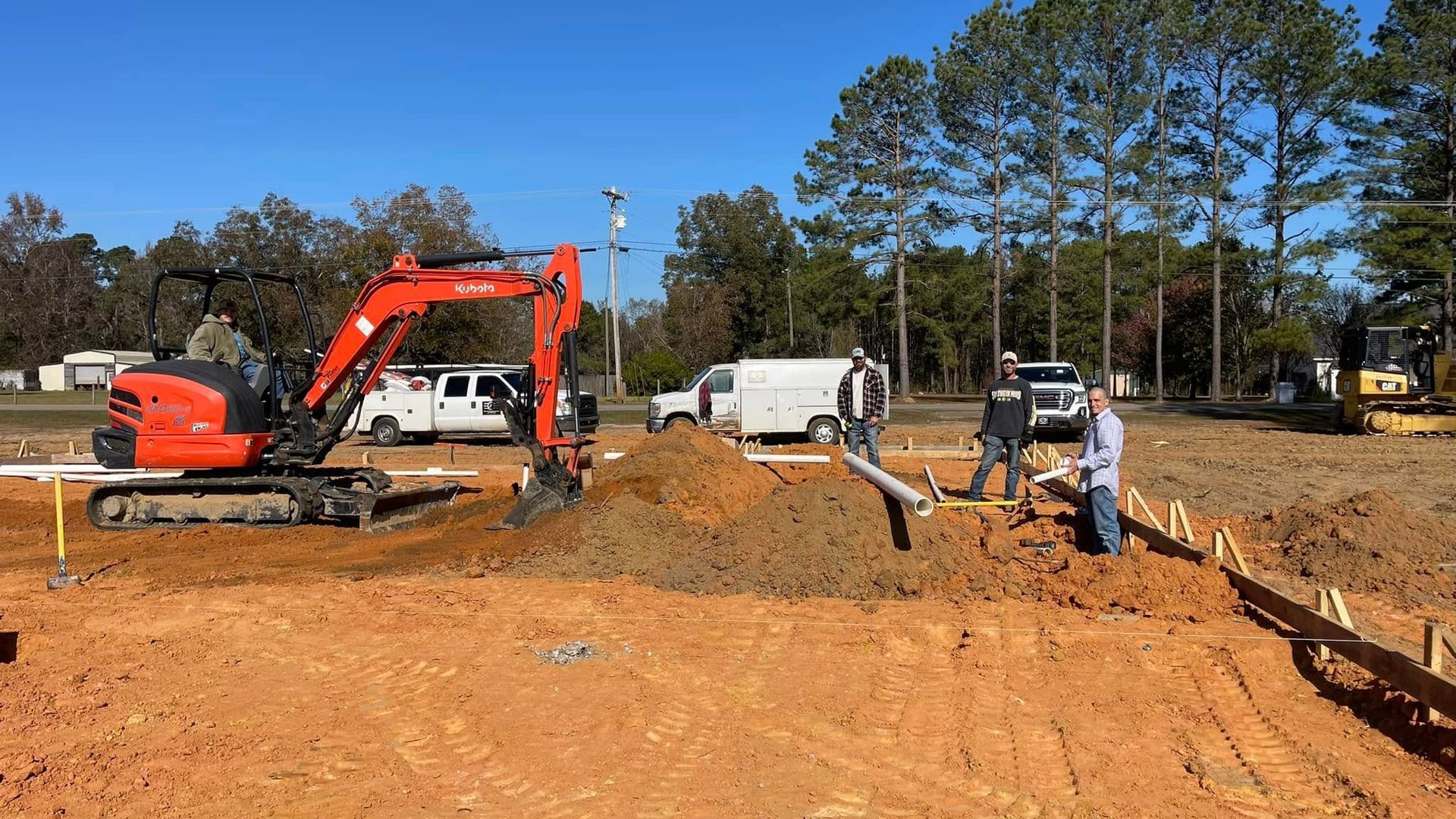 A group of construction workers are working on a construction site.