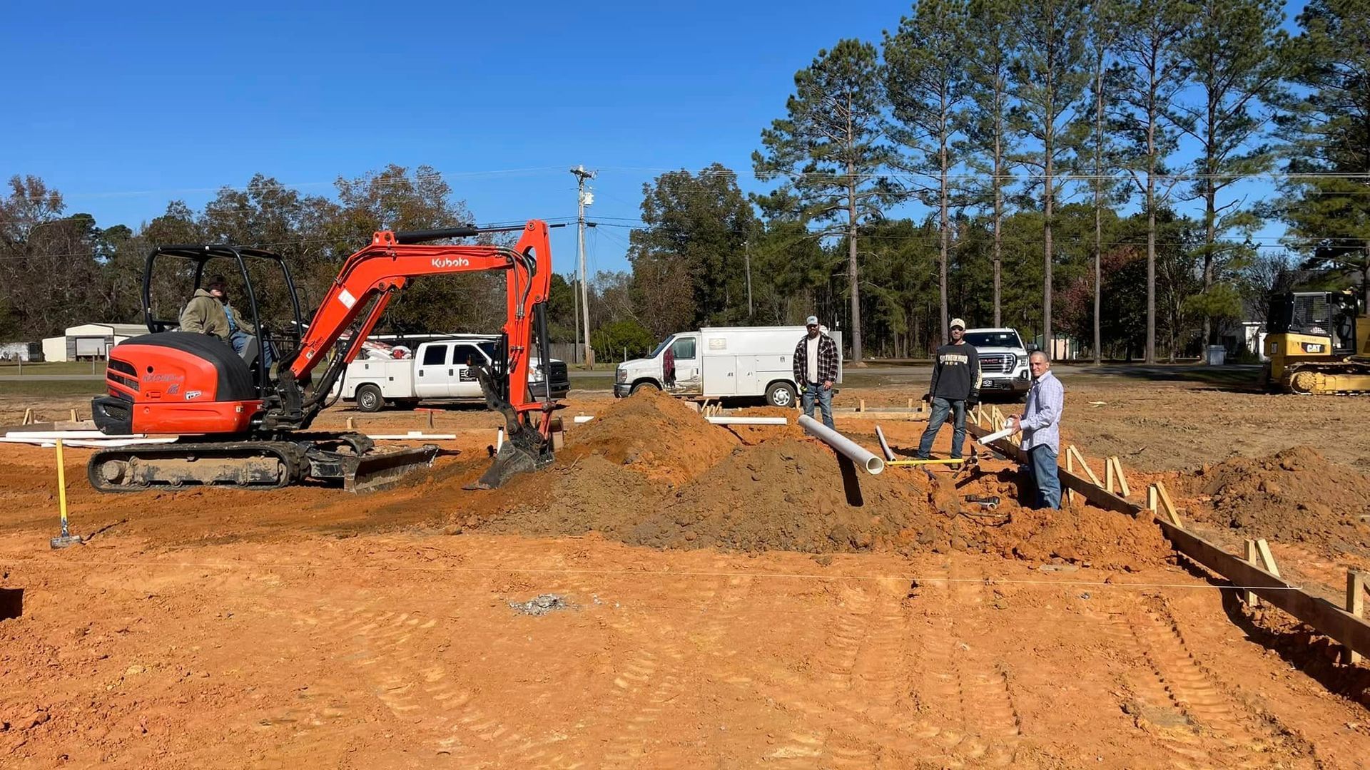 A group of construction workers are working on a construction site.