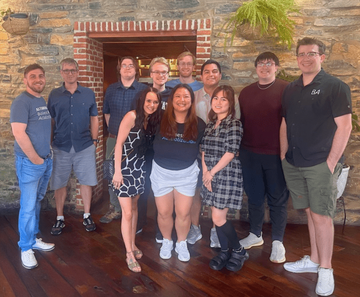 A group of people are posing for a picture together.