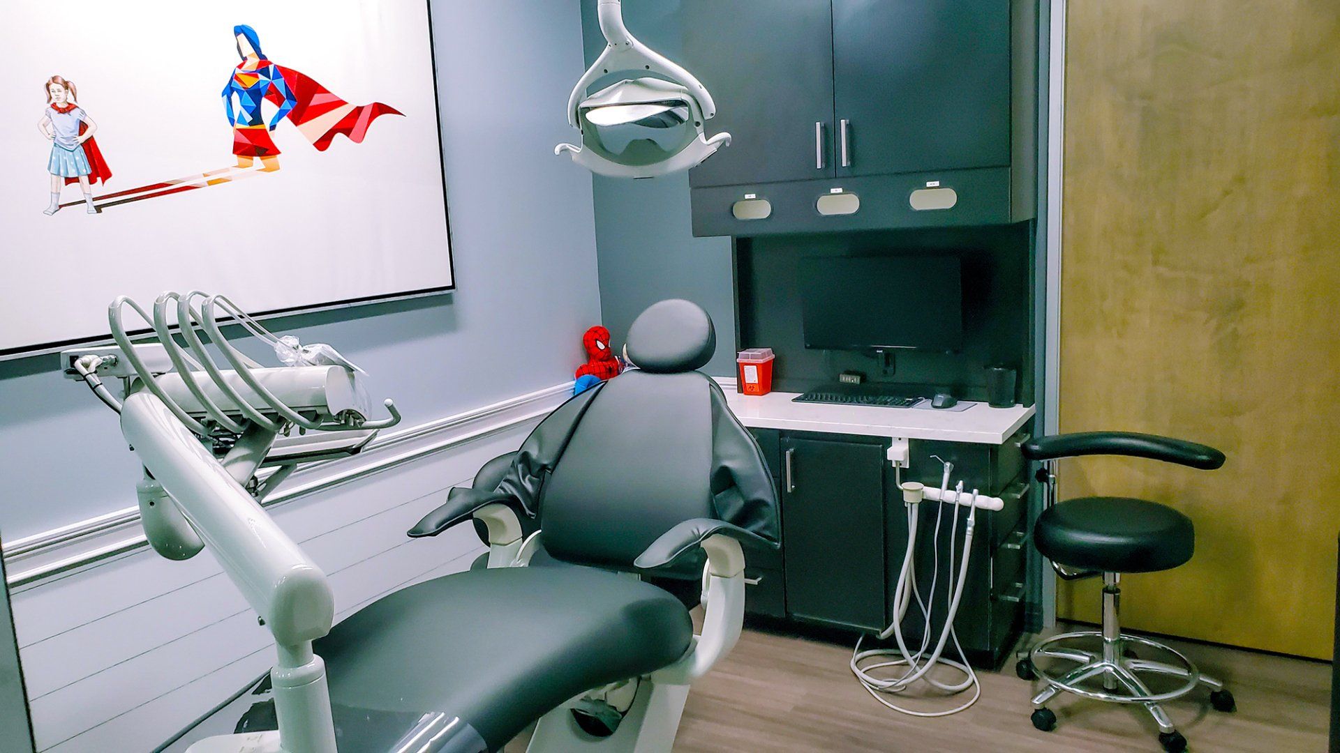Mighty Smiles Dental, Dallas & Fort Worth.  A dental office with a dental chair and a television on the wall.