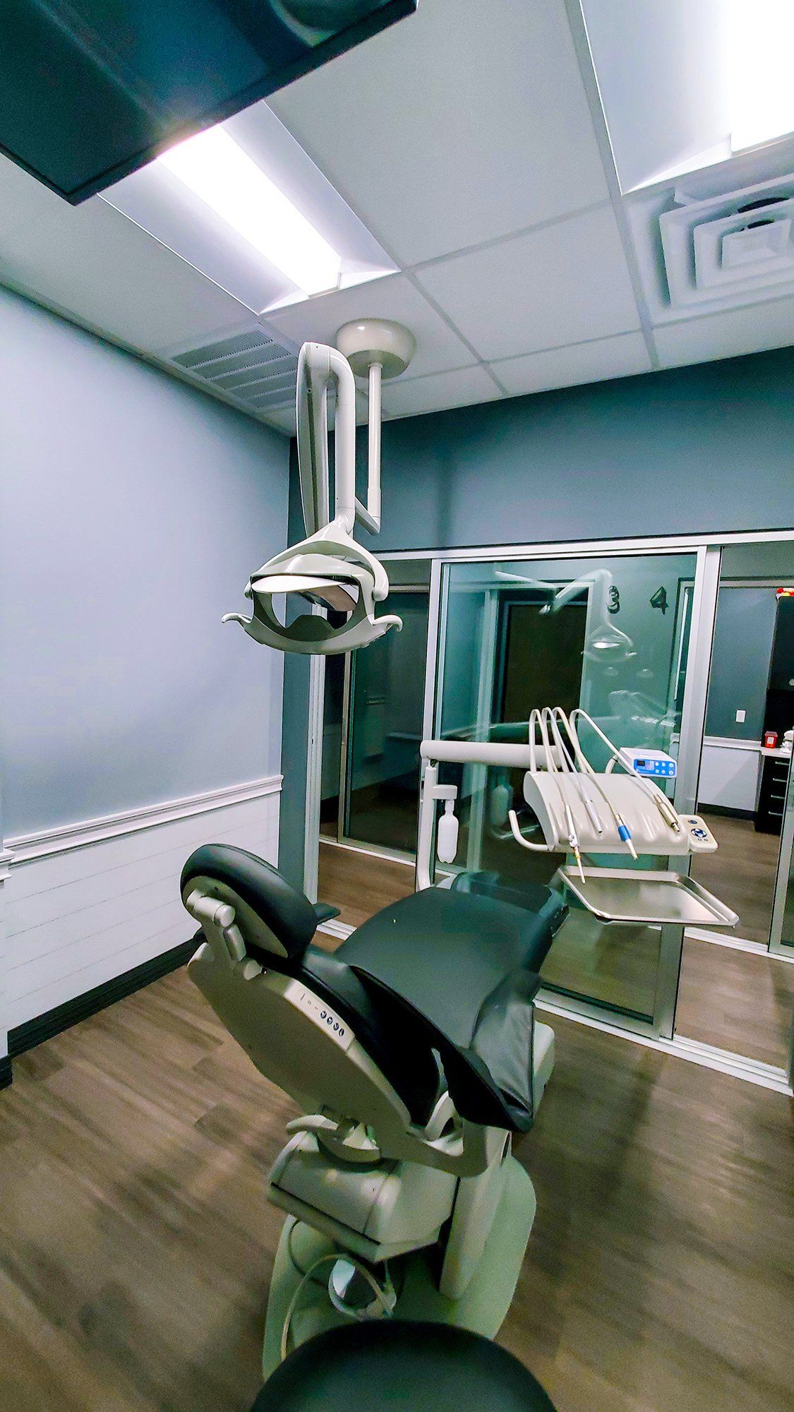 Mighty Smiles Dental, Dallas & Fort Worth.  A dental office with a dental chair and dental equipment.