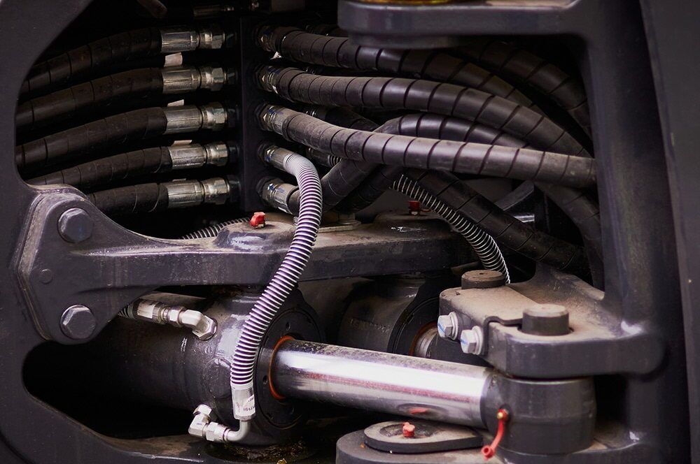 A Close up Of a Hydraulic System on A Machine — Parkes Machinery Services PTY LTD in West Wyalong, NSW