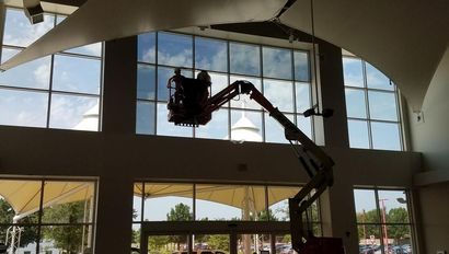 Installing Film on Window in Commercial Building
