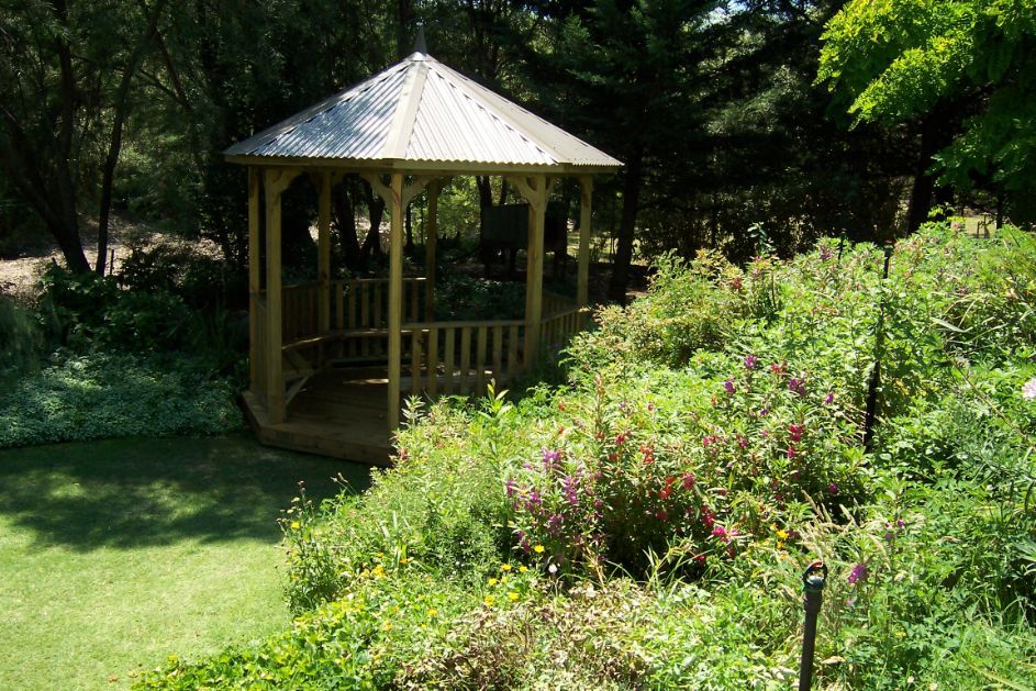 Wooden Gazebo Surrounded With Plants — Custom Blinds in Wodonga, NSW