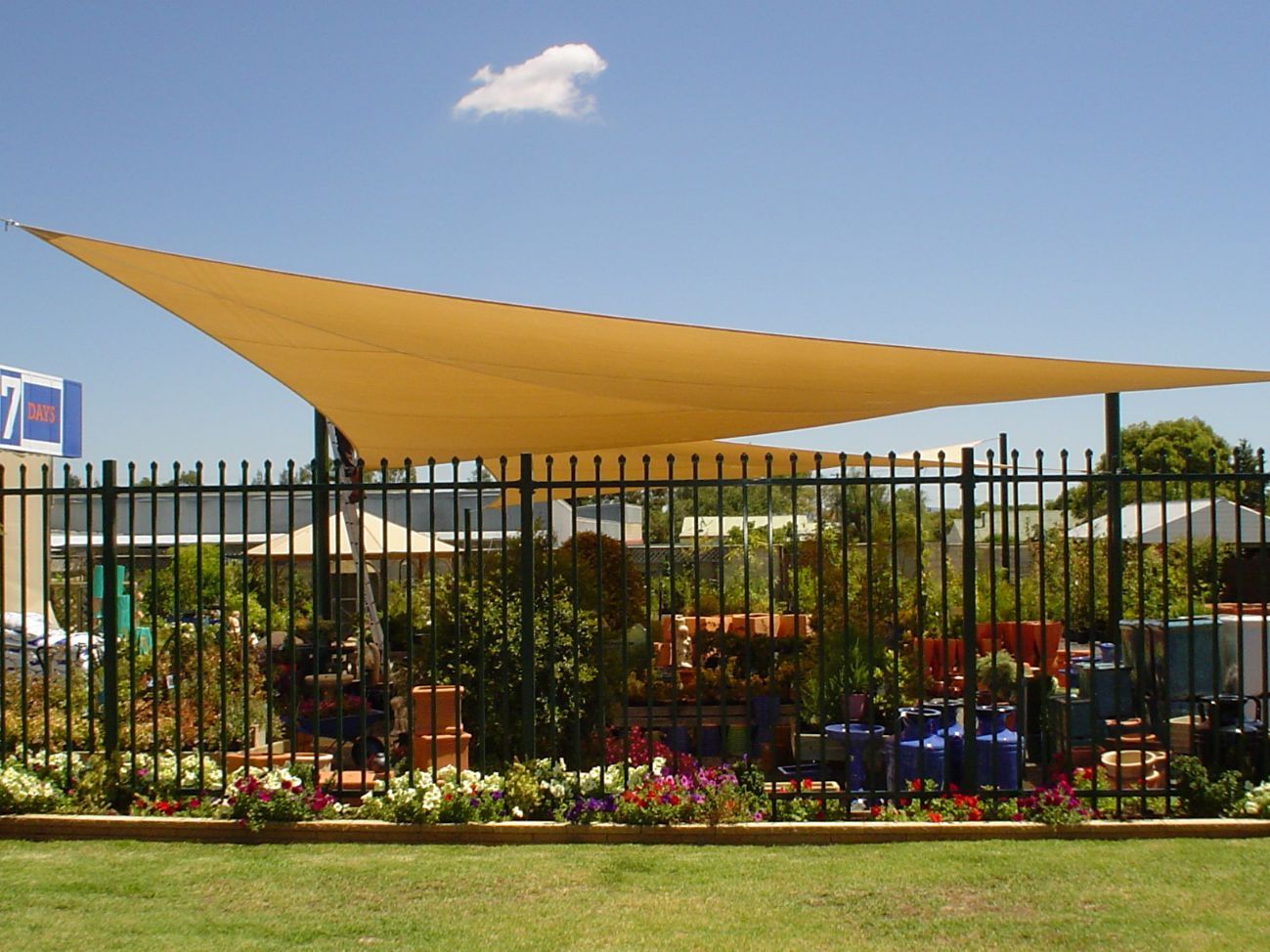 Yellow Shade Sails Installed On The Garden — Custom Blinds in Bright, NSW