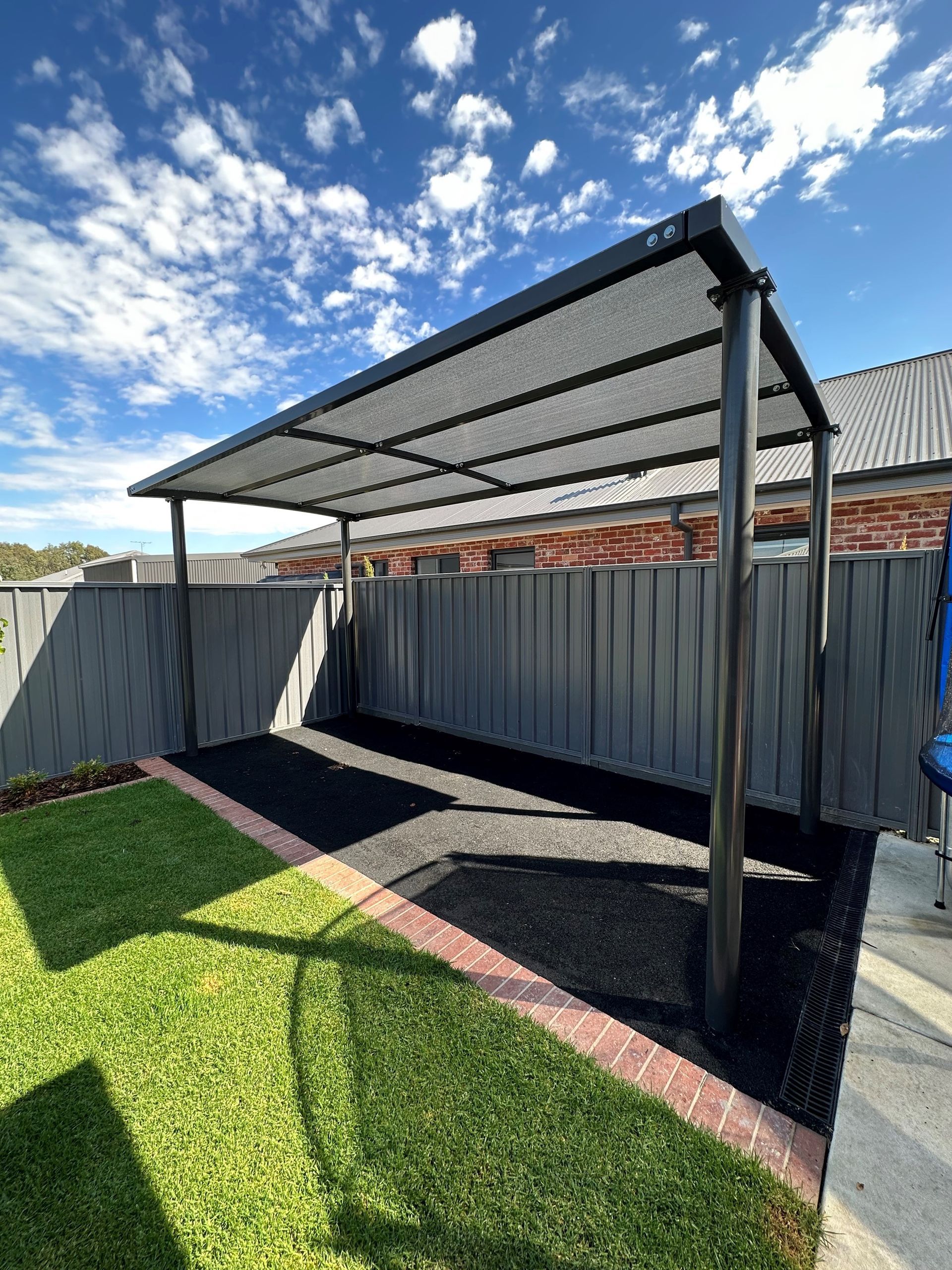 White Vehicle Park Under A Cantilever Shade Structures — Custom Blinds in Yarrawonga, NSW