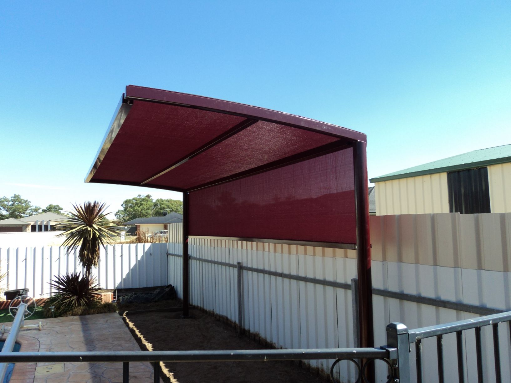 Side View Of Red Cantilever Shade Structure — Custom Blinds in Albury, NSW