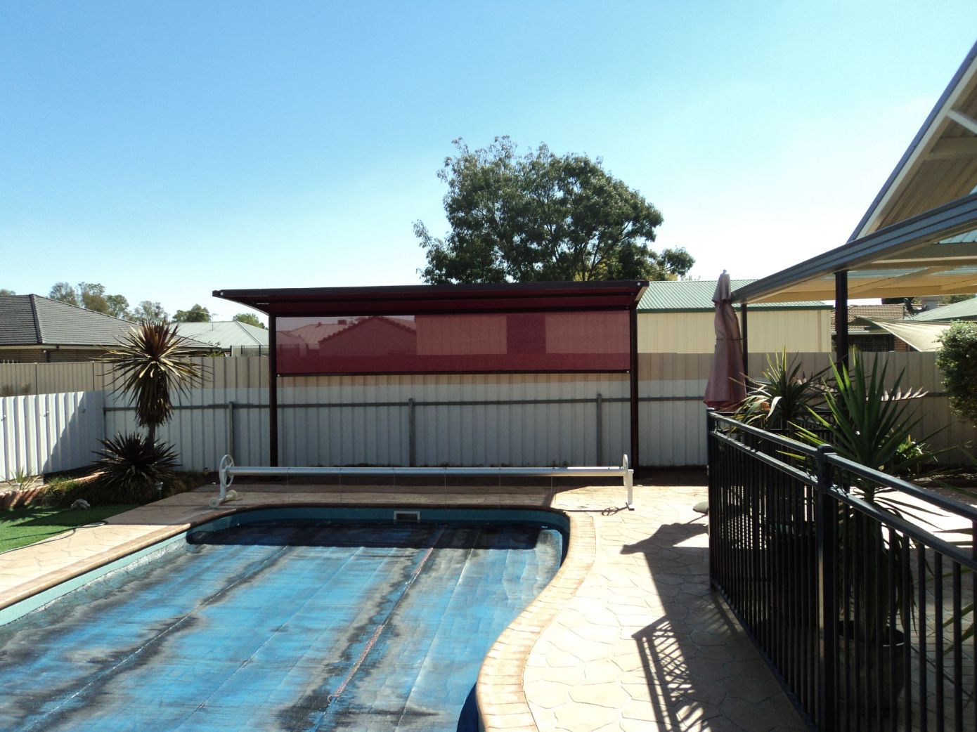Red Cantilever Shade Structure Near The Covered Pool — Custom Blinds in Albury, NSW