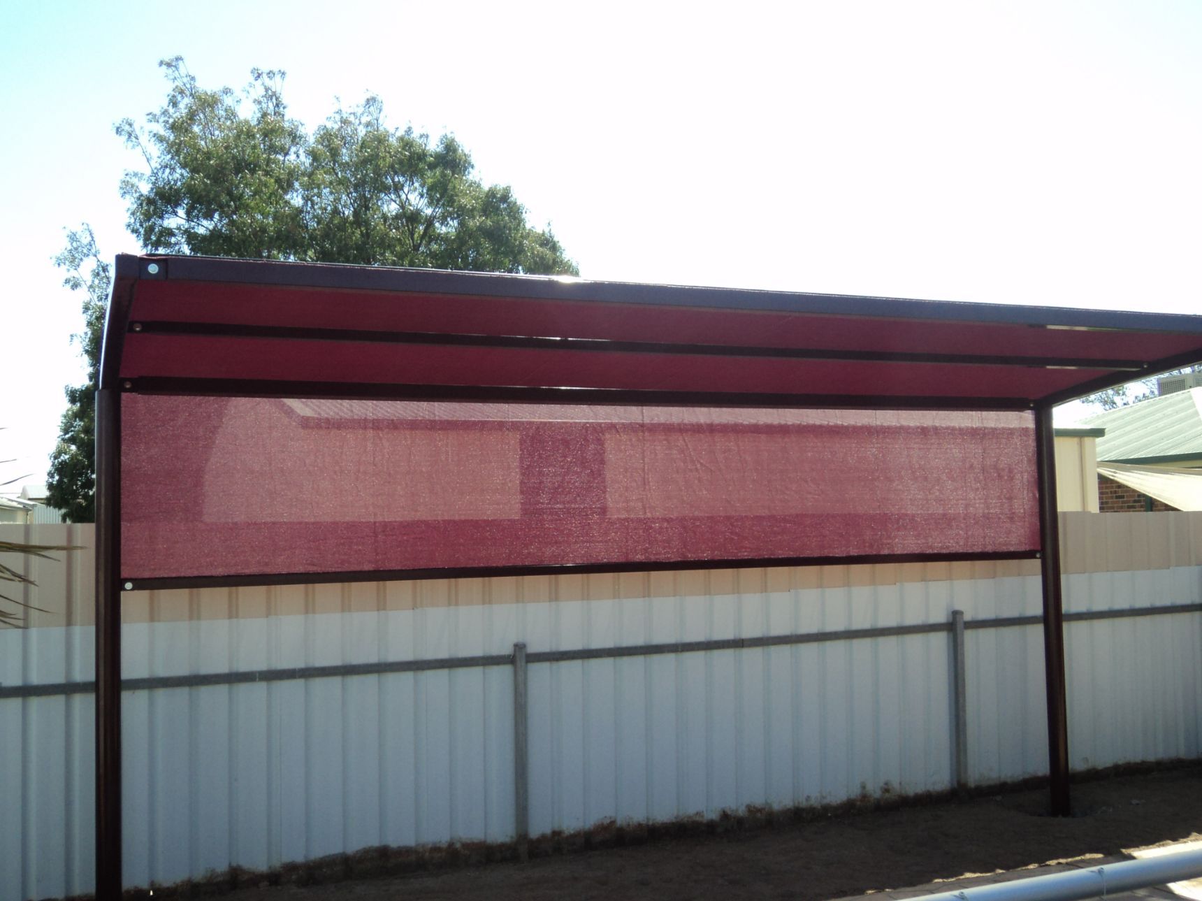Close-Up Of Red Cantilever Shade Structure — Custom Blinds in Albury, NSW