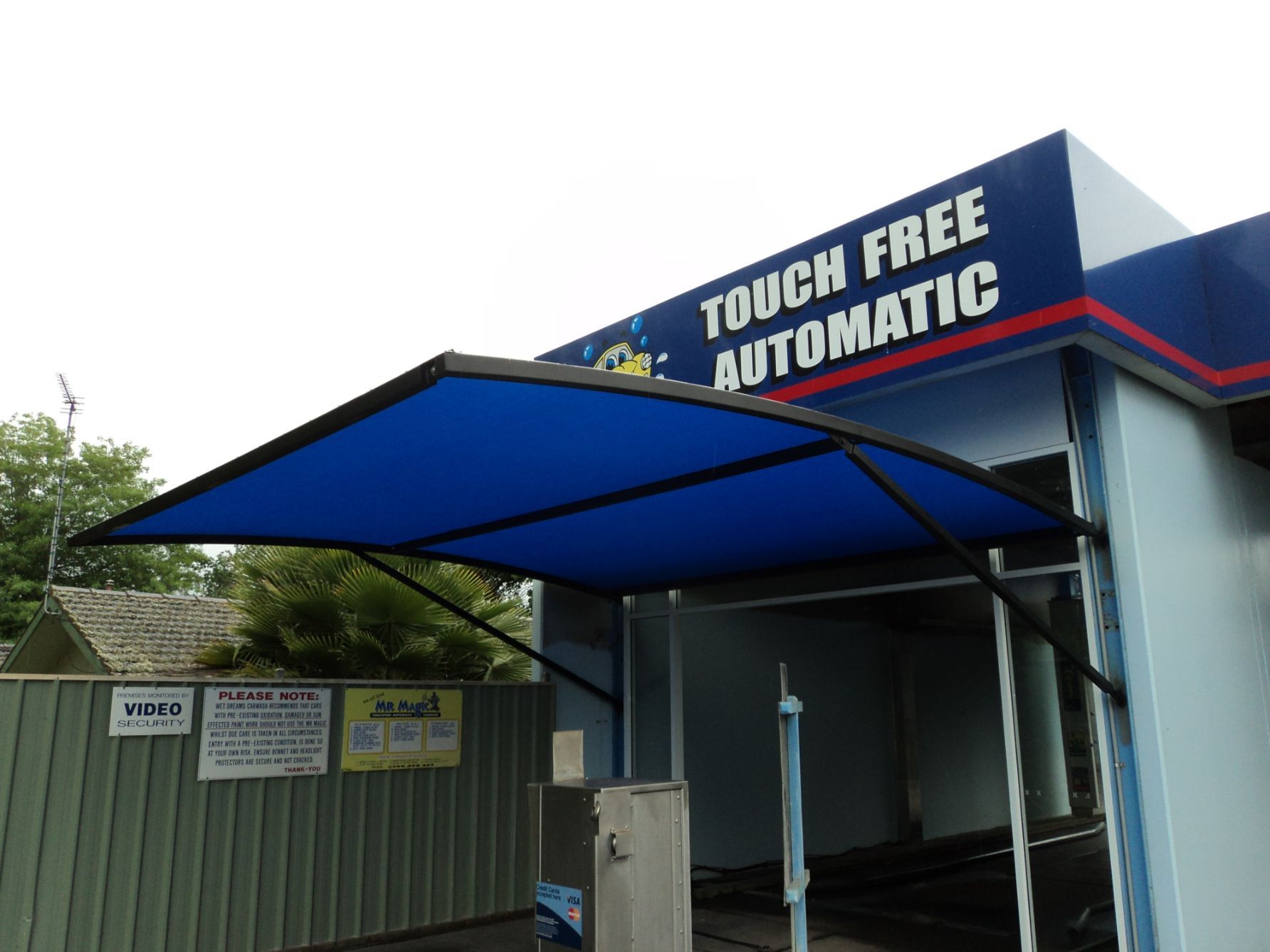 Blue Cantilever Shade With Black Steel Frames At The Carwash — Custom Blinds in Wodonga, NSW
