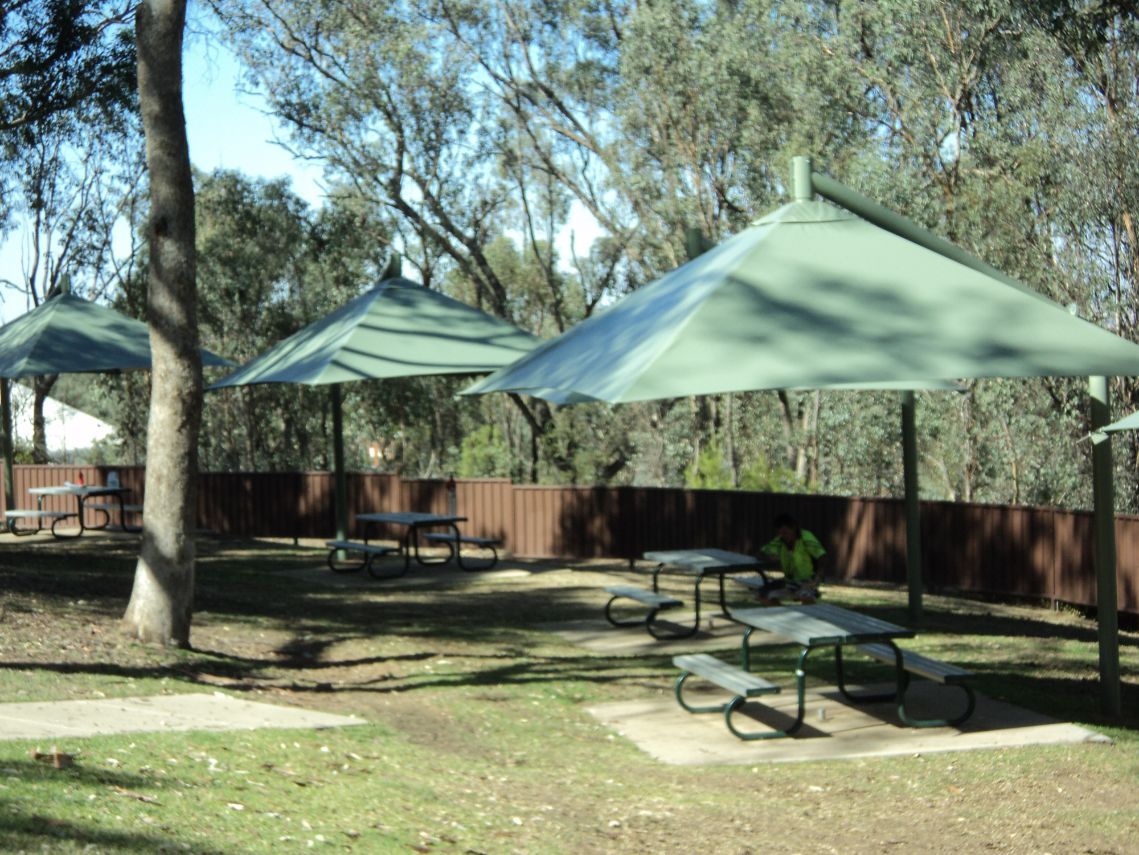 Green Cantilever Umbrella — Custom Blinds in Wodonga, NSW