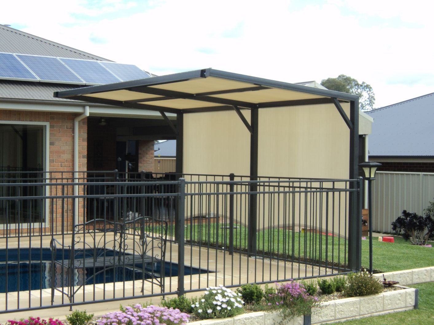 Plants Near Fence & A Cantilever Shade Structure — Custom Blinds in Yarrawonga, NSW