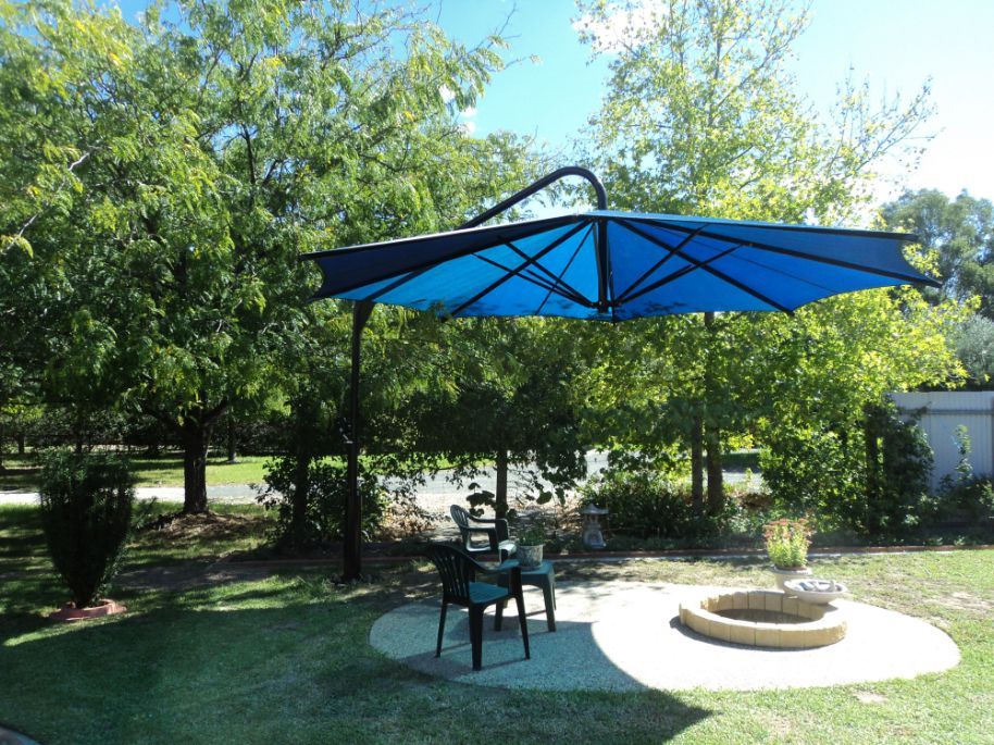 Swing & Fold Blue Umbrella — Custom Blinds in Wodonga, NSW