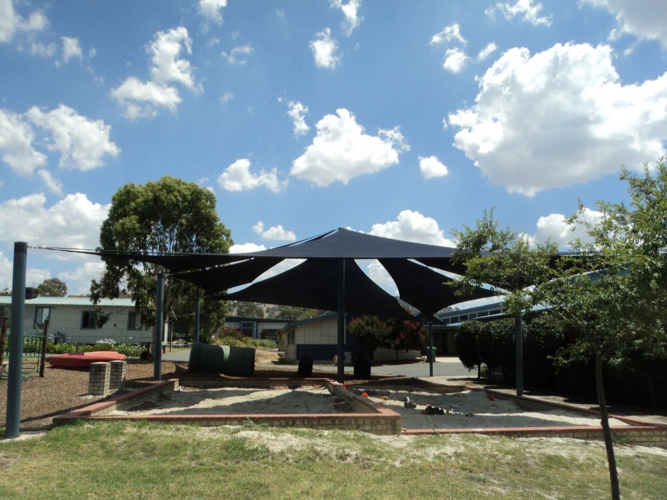 Sandbox Play Area Under A Black Shade Sails — Custom Blinds in Corowa, NSW
