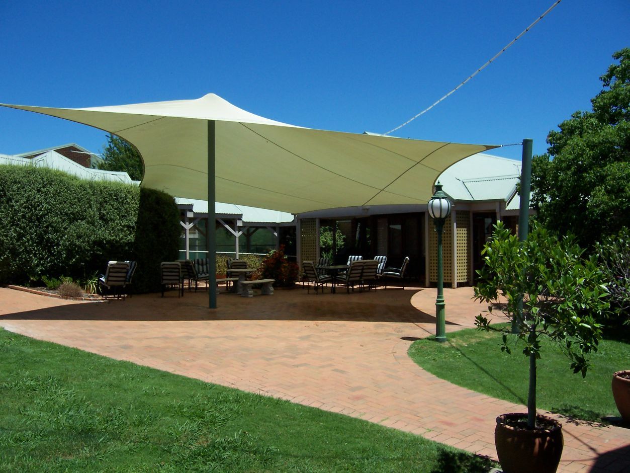 White Shade Sails At The Outdoor Area — Custom Blinds in Wangaratta, NSW