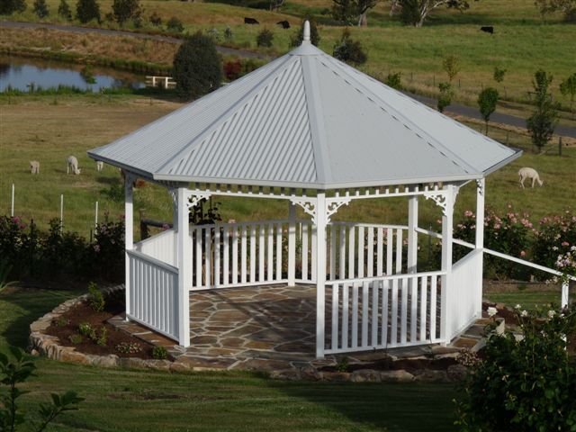 A White Gazebo Is Sitting In The Middle Of A Grassy Field - Gazebos in Albury, NSW