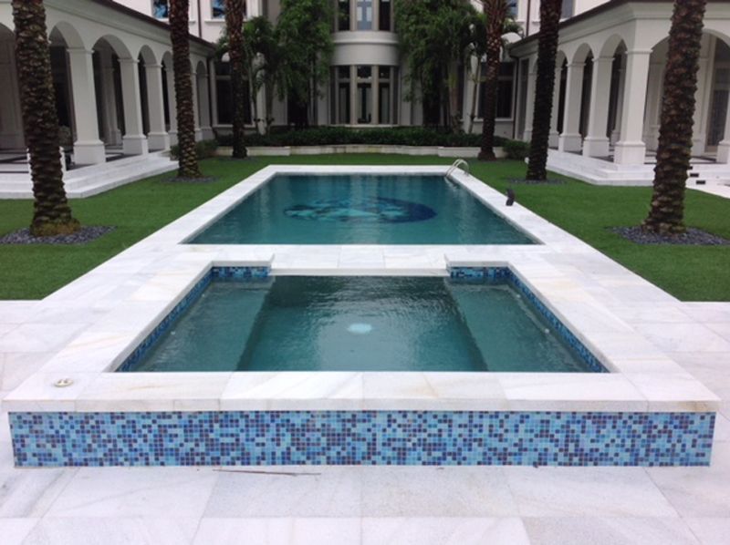 A large swimming pool in the middle of a house