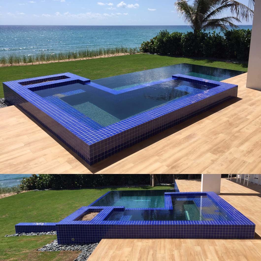 A large swimming pool with a view of the ocean