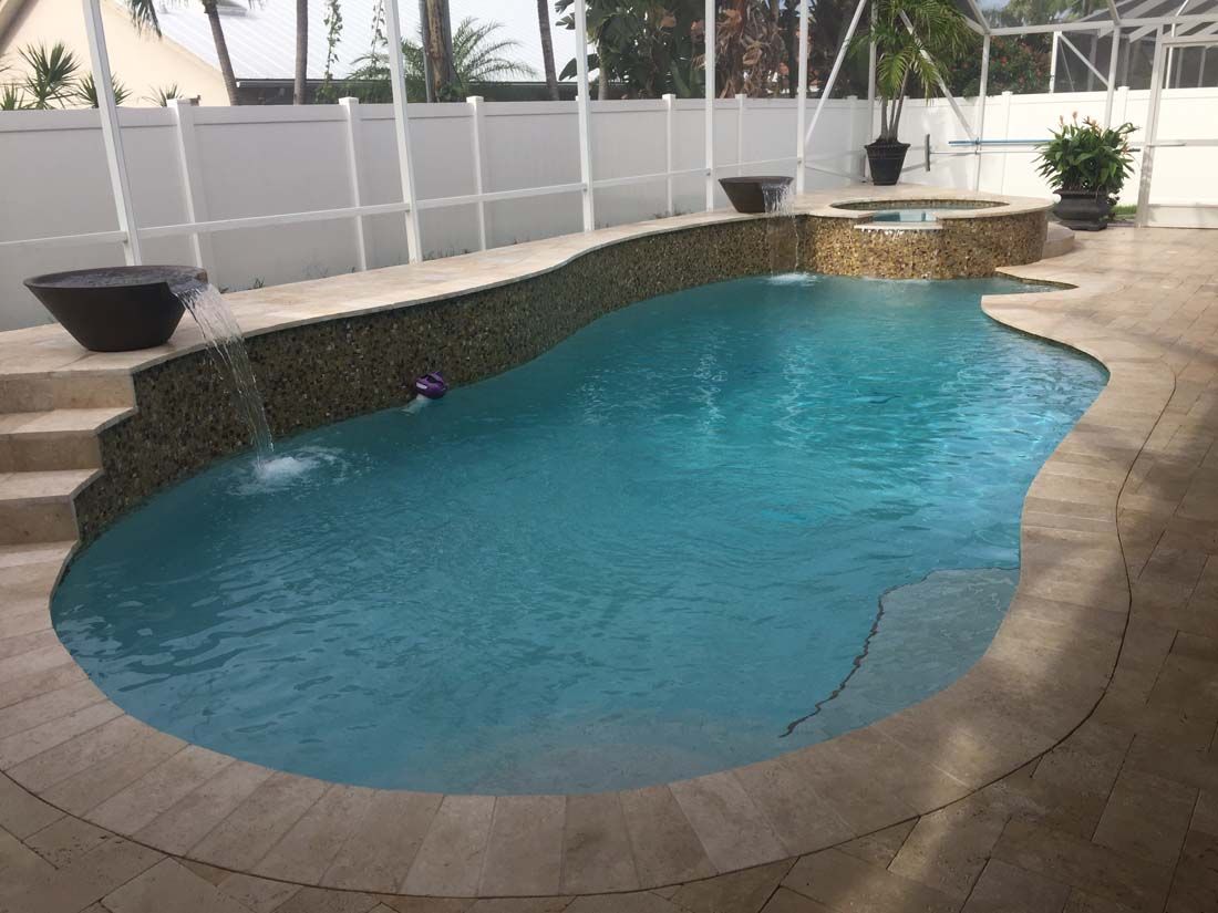 A large swimming pool with stairs leading up to it