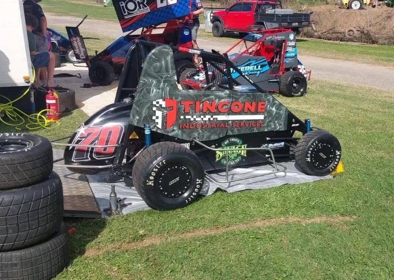 A Black and Green Sprint Car on the Grass — Tincone Pty Ltd in Paget, QLD