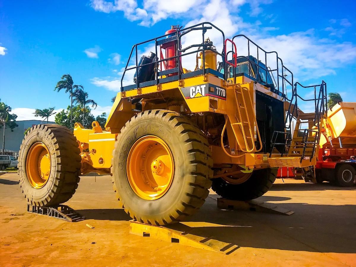 Yellow Caterpillar Mining Truck With Massive Tires — Tincone Pty Ltd in Paget, QLD