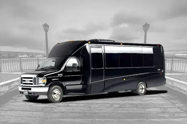 A black van is parked on the side of a road.
