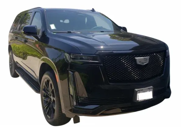 Black Cadillac Escalade SUV, front view.