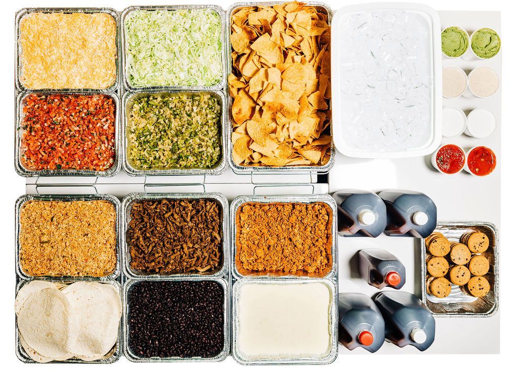 a variety of food including tortilla chips and sauces