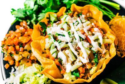 a close up of a taco salad on a plate