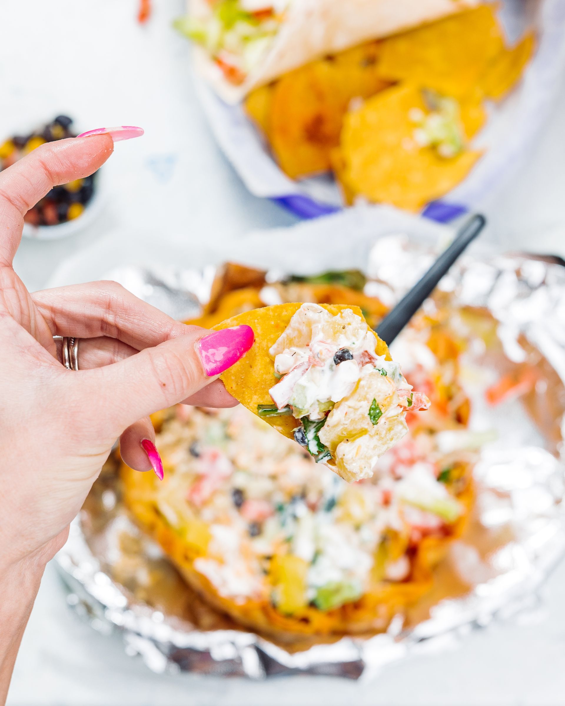 A person is holding a piece of food in their hand.