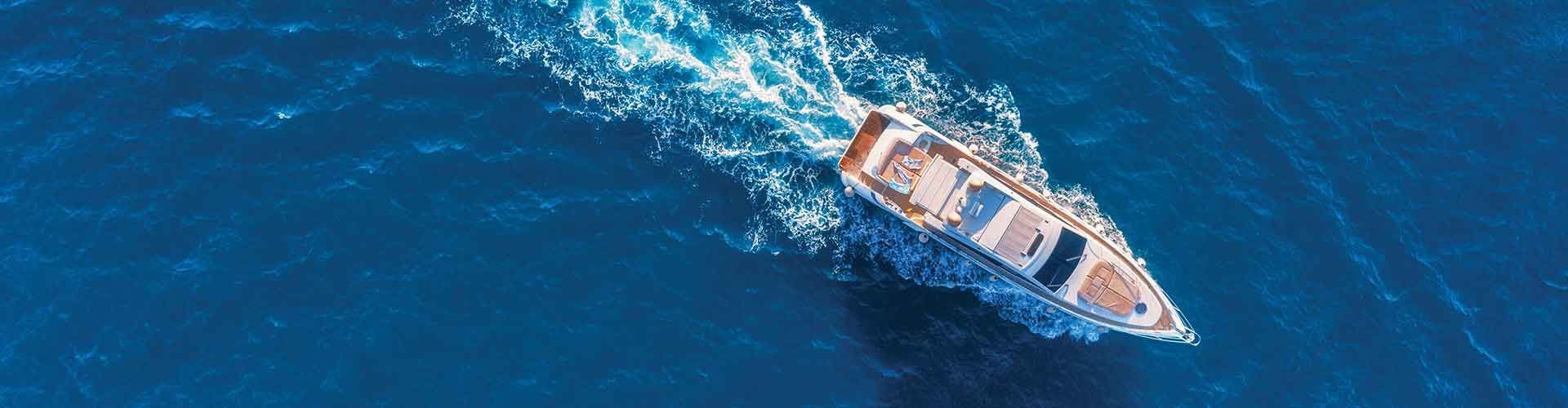 A recreational boat steaming through blue ocean A recreational boat steaming through blue ocean