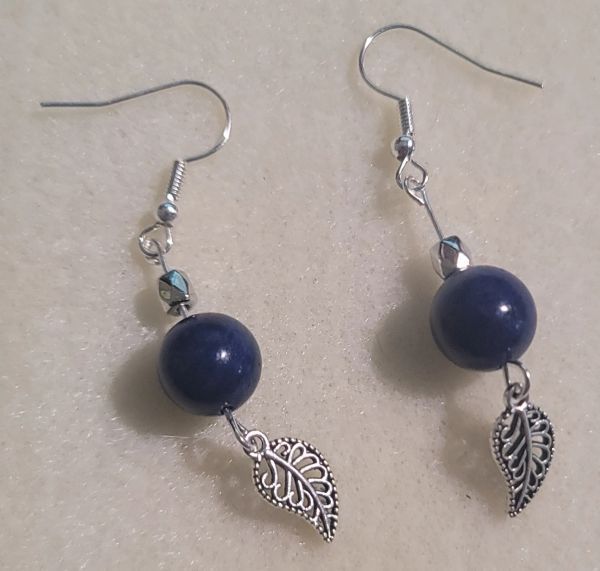 Dark blue bead earrings with silver leaf charms.
