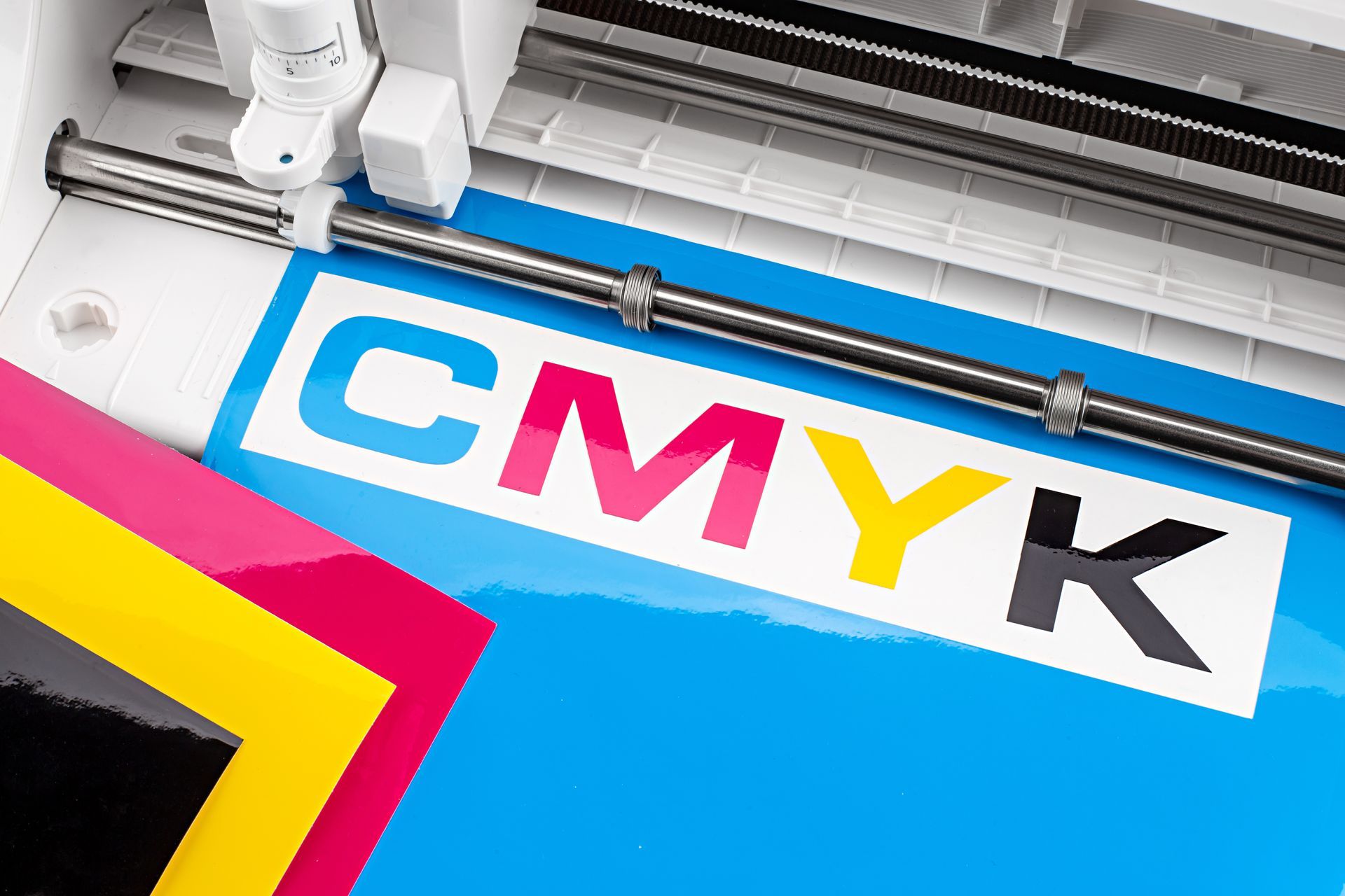 A vinyl cutter cutting the letters 