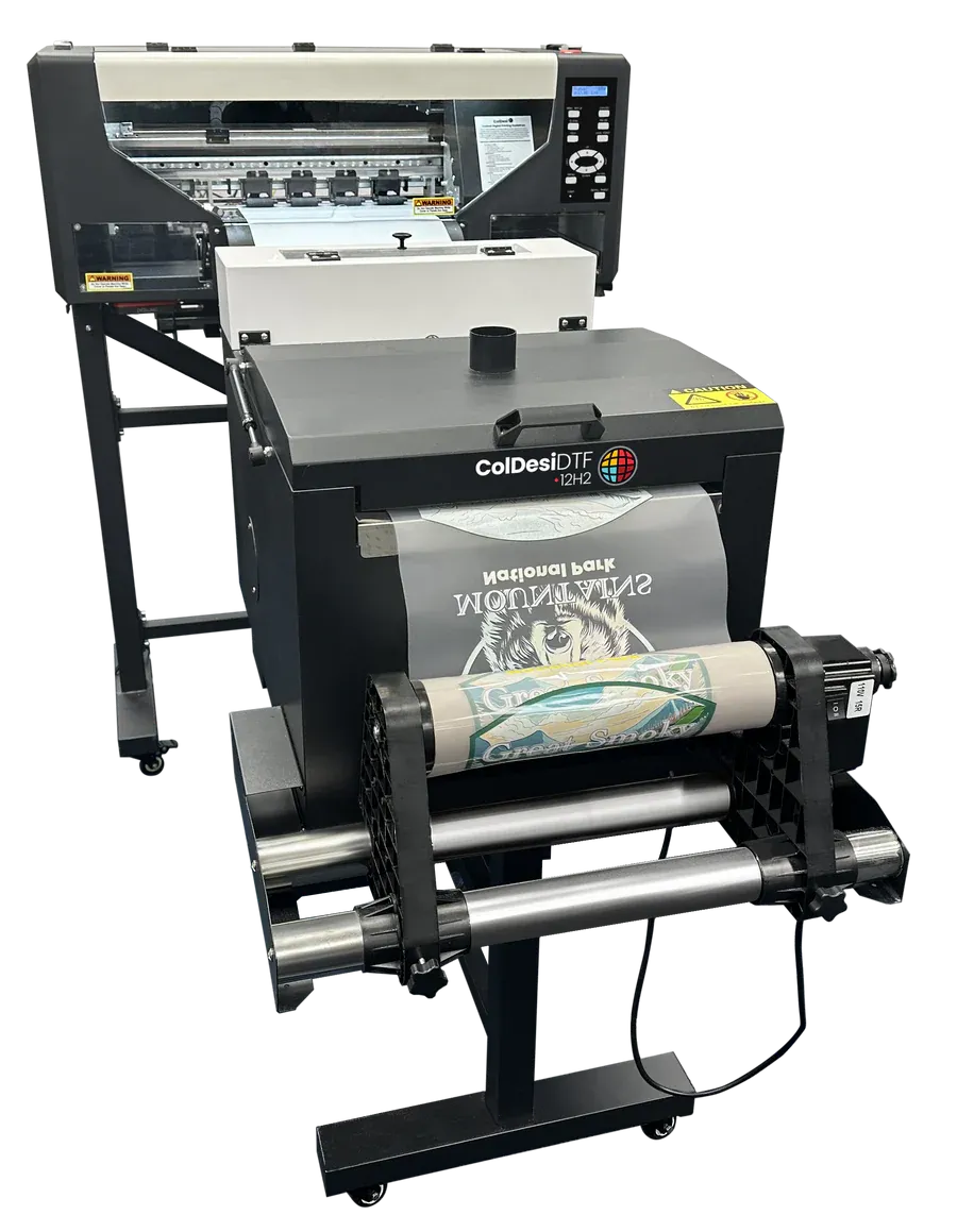 Man operating a large-format printer, adjusting a printed graphic. Printing workshop setting.