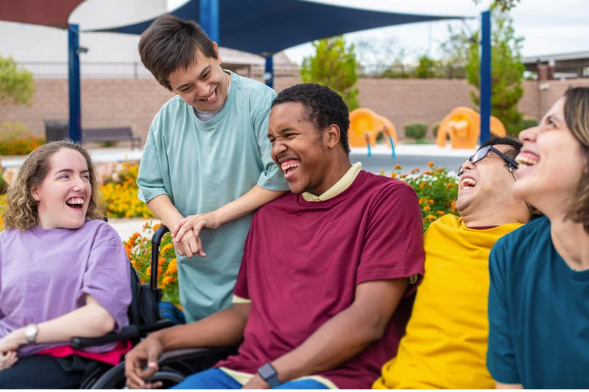 A Group Of People Laughing With Each Other — Eleos Support Services In Lavington, NSW