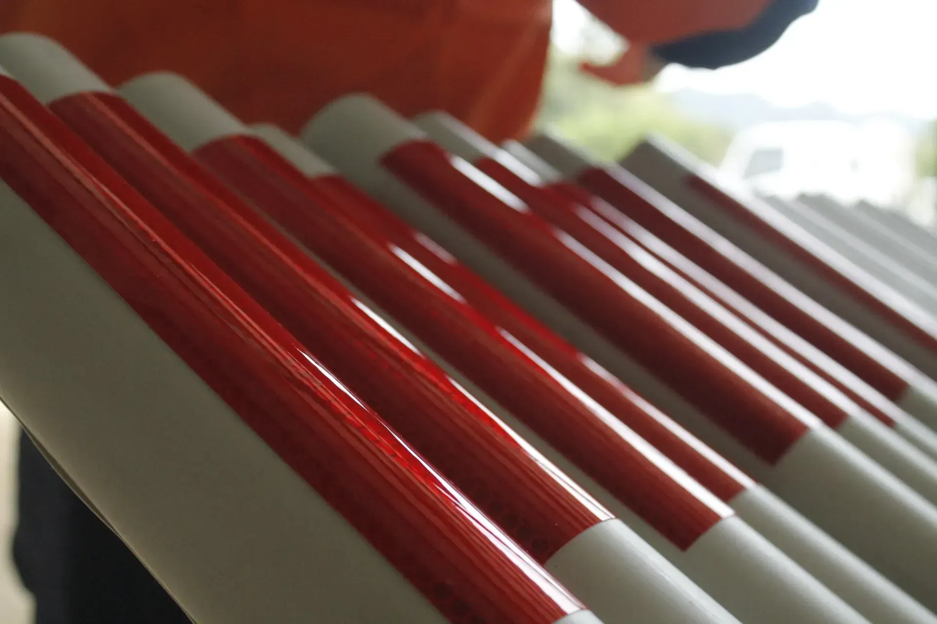 Row of white and red striped barriers, likely for traffic or crowd control.
