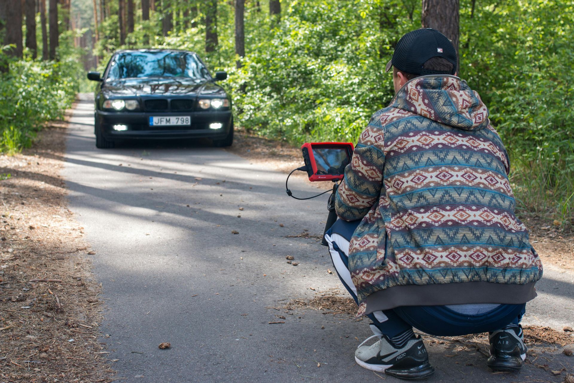 Technician performing precise mobile ADAS camera calibration.