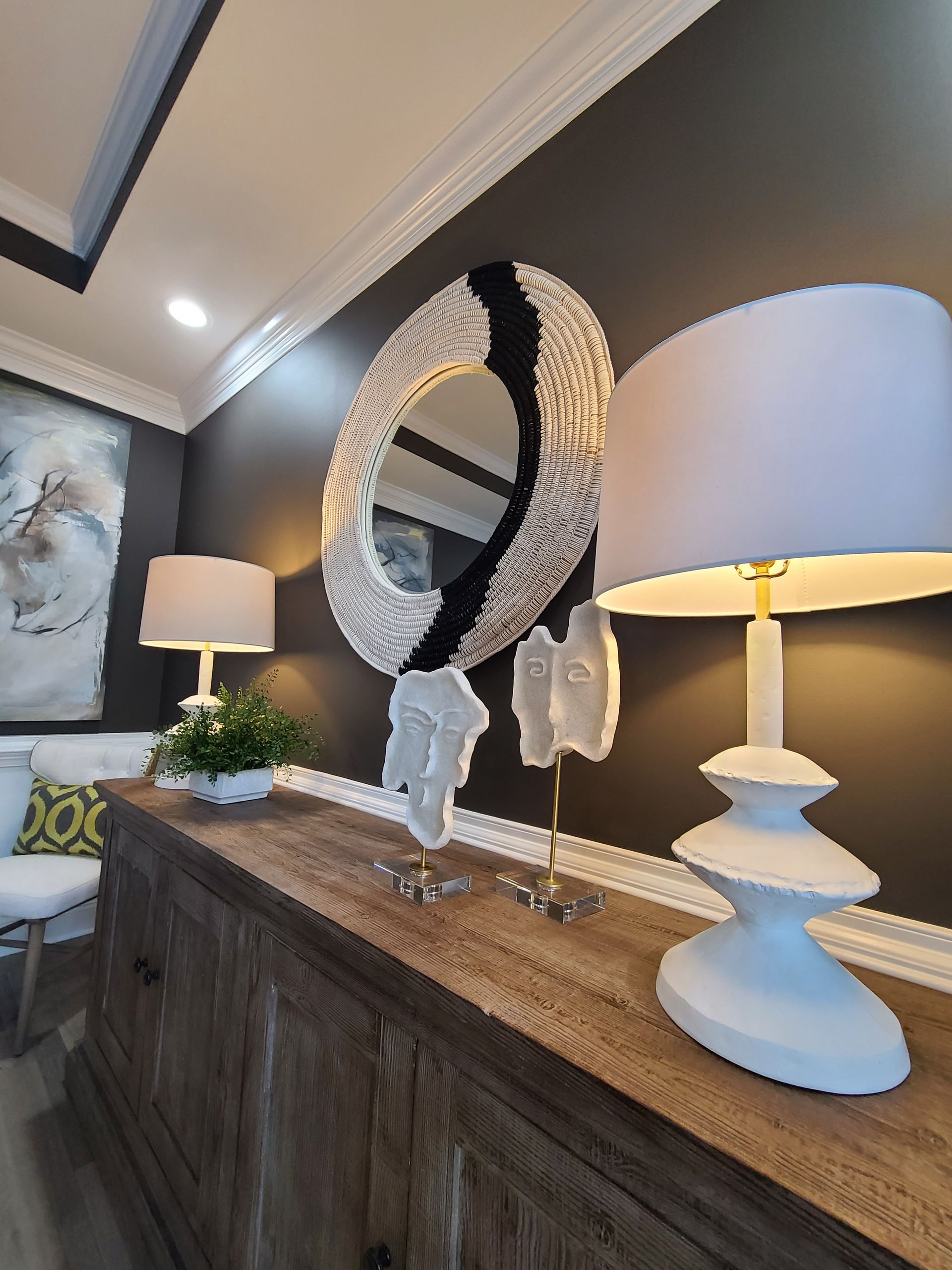 mirror on the wall with 2 lampshades
